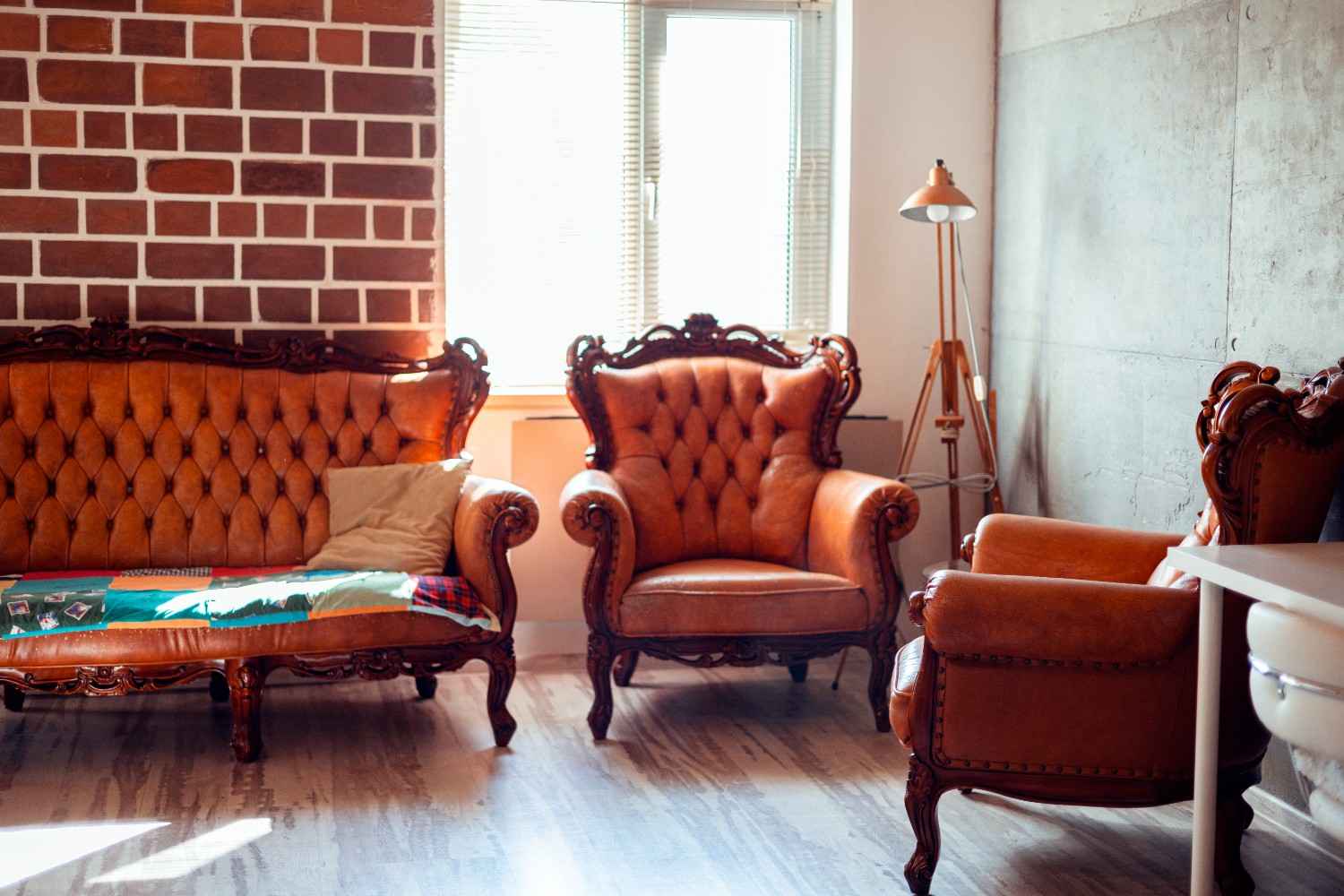 Classic Chesterfield sofa restored with modern upholstery and deep button tufting